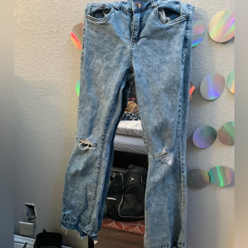 boot leg low rise jeans, light wash , ripped at knees(came like that)